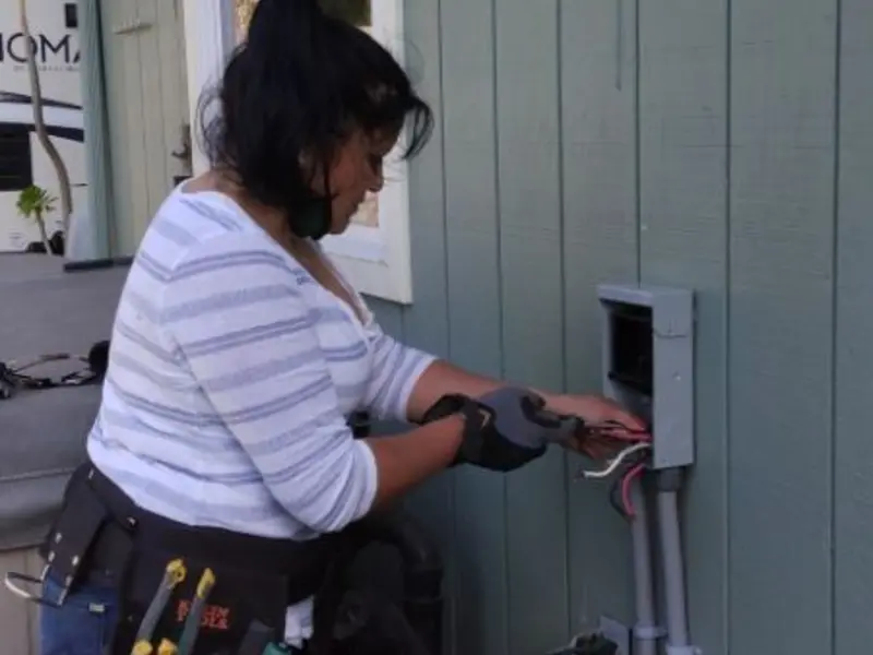 Licensed electrician wiring an exterior subpanel in June Park