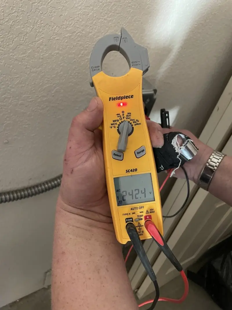 Voltage testing with clamp meter during Generator Installation in June Park
